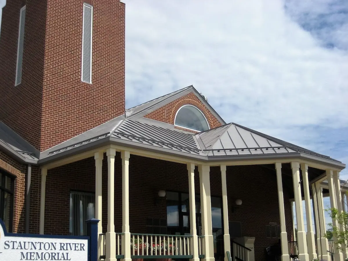 Skilled roofing craftsmen working on a residential roof in Nashua